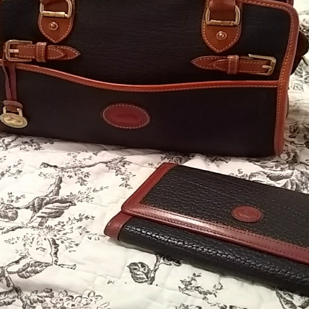 Dooney and Bourke black and tan satchel with walle